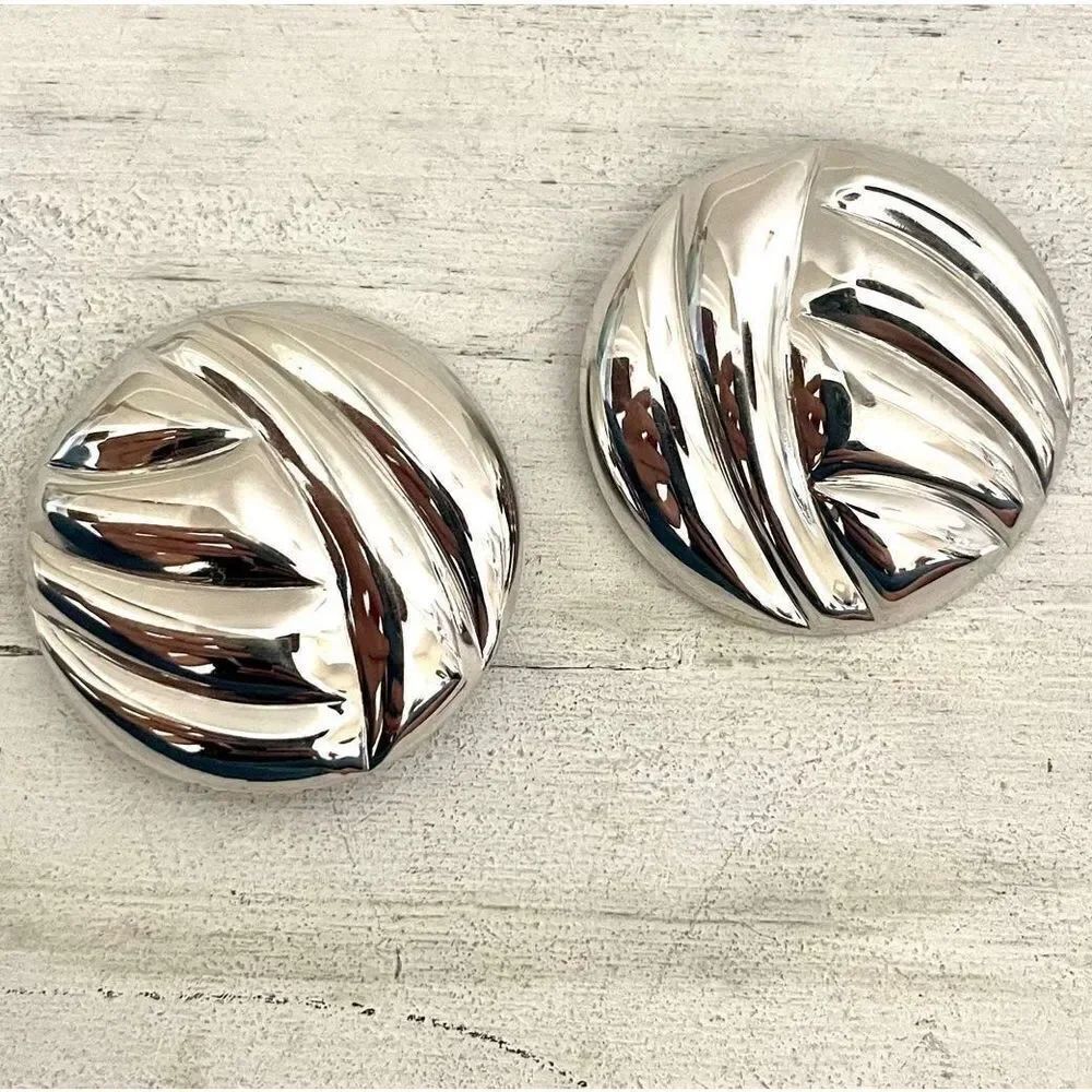 Large silver tone round clip on earrings